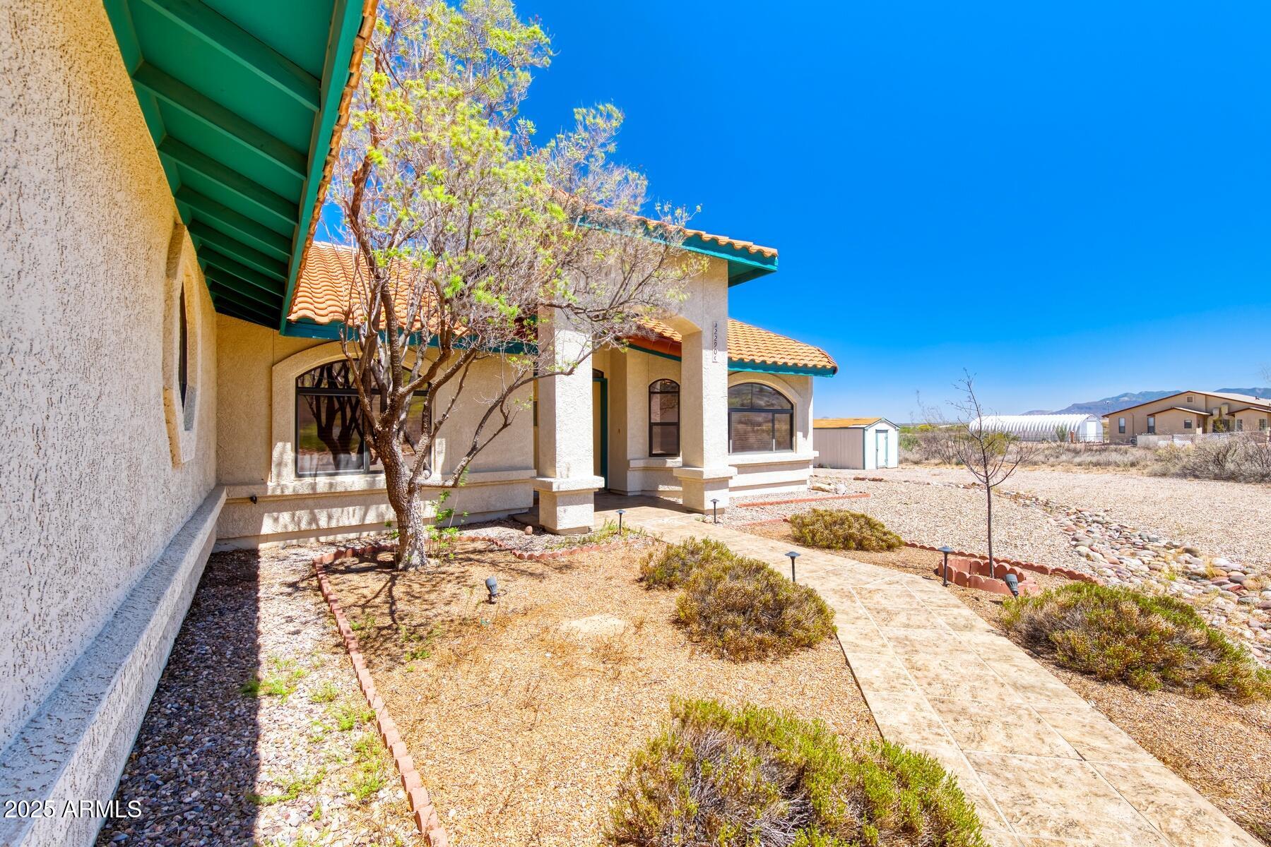 2290 North Ranch Trail Huachuca City, AZ 85616 - Photo 5 of 28 a view of a house with a snow in the background