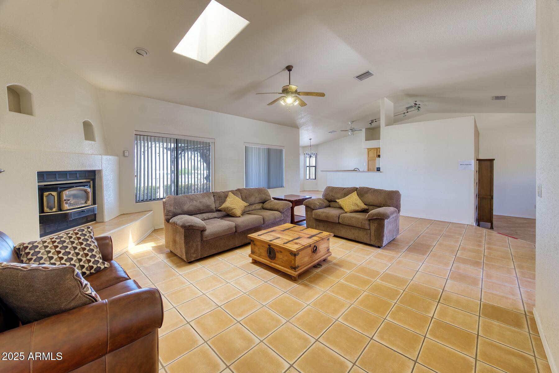 2290 North Ranch Trail Huachuca City, AZ 85616 - Photo 6 of 28 a living room with furniture and a fireplace