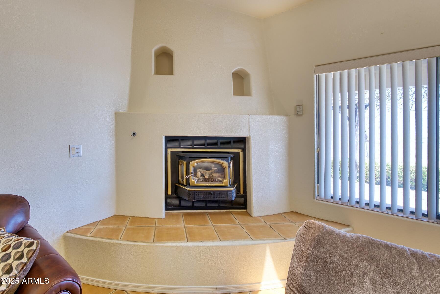 2290 North Ranch Trail Huachuca City, AZ 85616 - Photo 8 of 28 a living room with furniture and a fireplace
