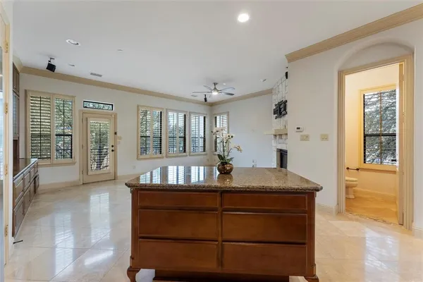a view of kitchen island with cabinets and wooden floor