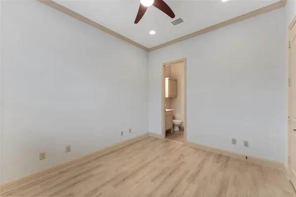 an empty room with a empty space and a ceiling fan