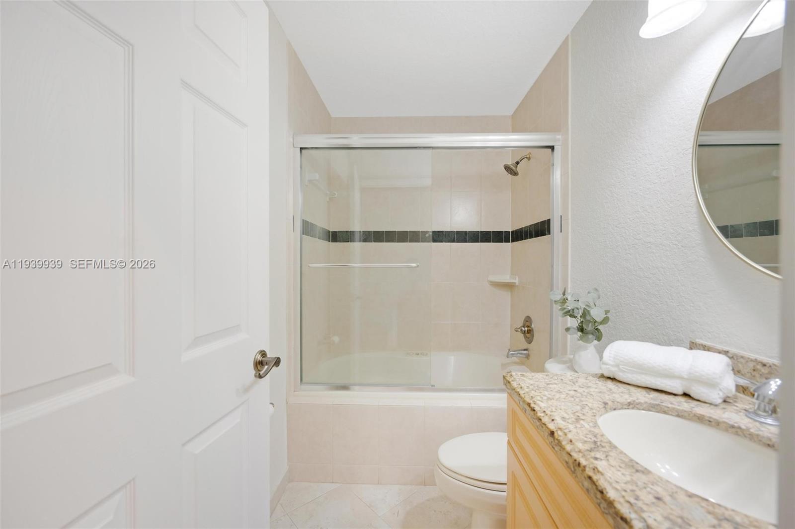 12851 Luray Road Southwest Ranches, FL 33330 - Photo 11 of 43 a bathroom with a granite countertop bathtub shower sink vanity and toilet