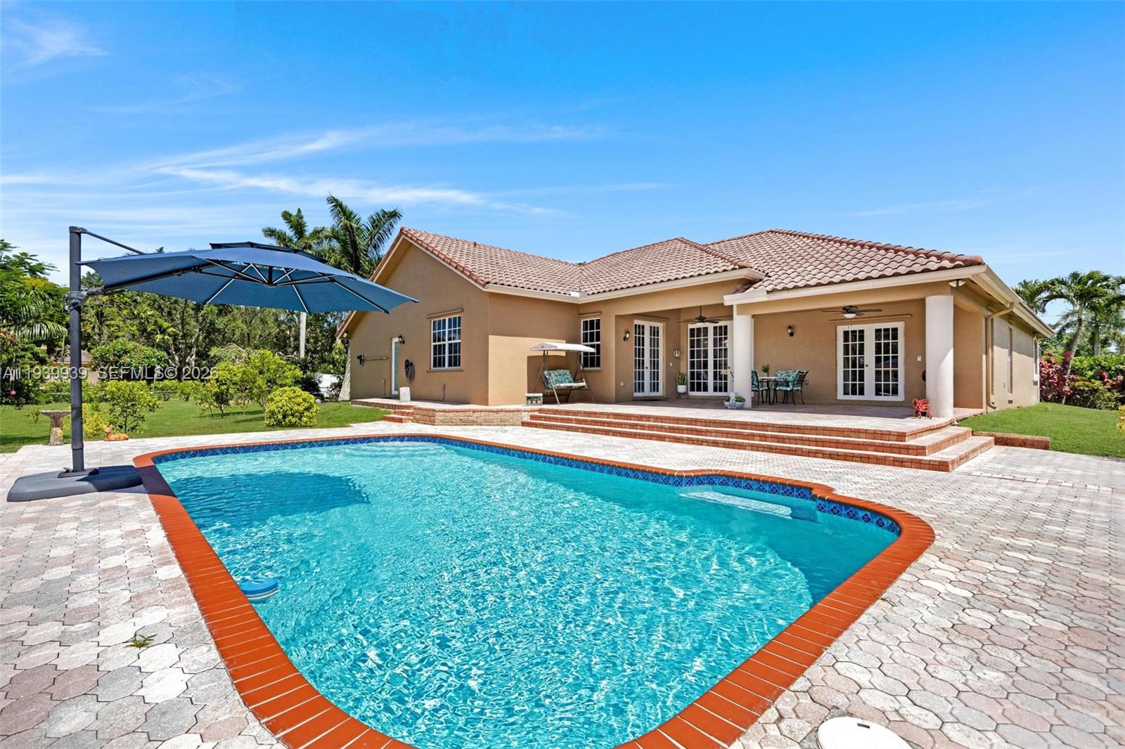 12851 Luray Road Southwest Ranches, FL 33330 - Photo 15 of 43 a view of a house with swimming pool