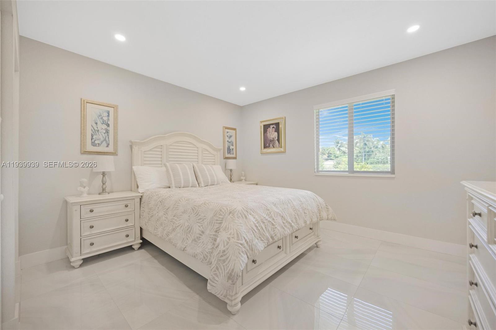 12851 Luray Road Southwest Ranches, FL 33330 - Photo 24 of 43 a bedroom with a bed and a window