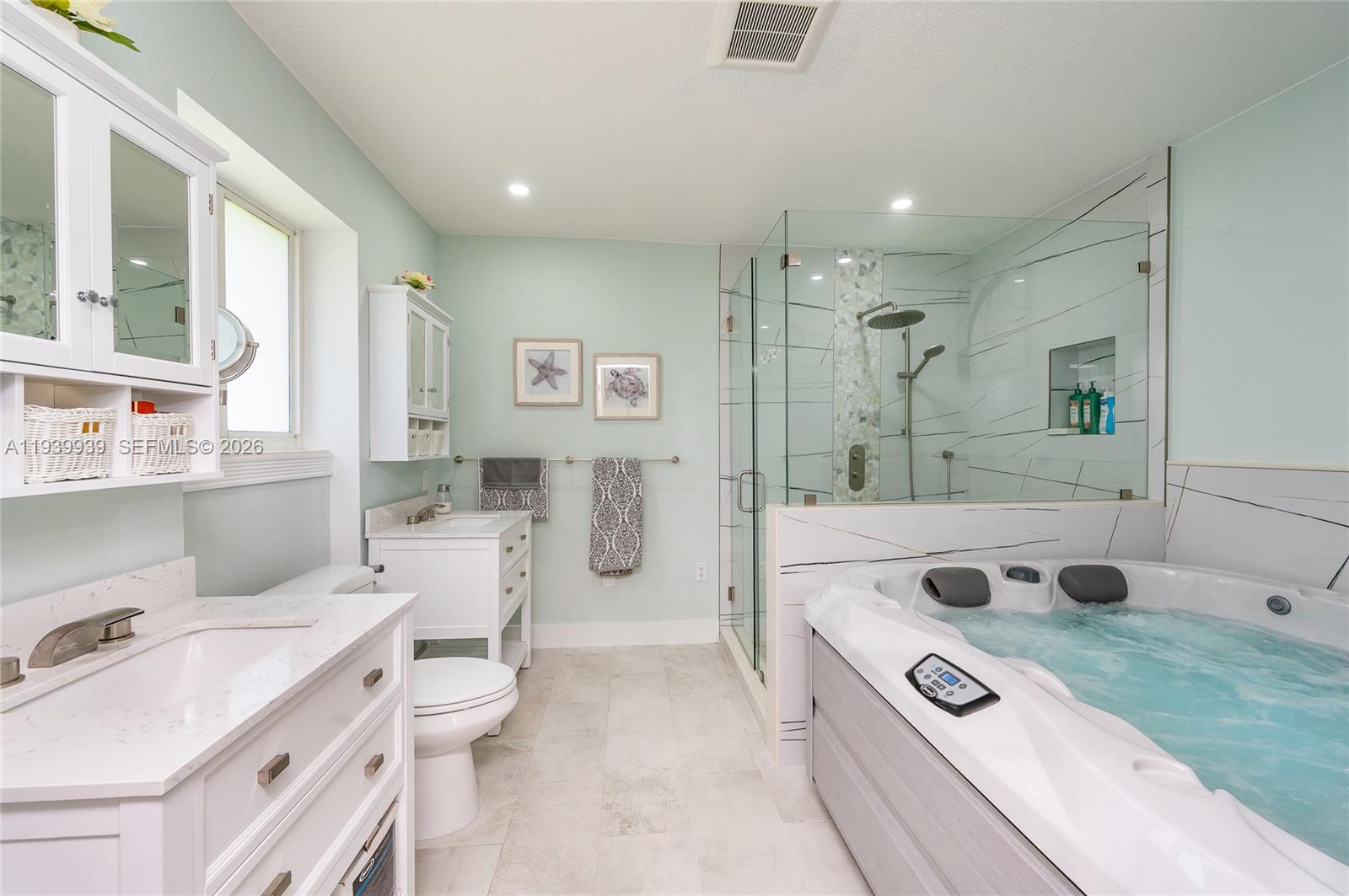 12851 Luray Road Southwest Ranches, FL 33330 - Photo 25 of 43 a bathroom with a tub sink toilet and view