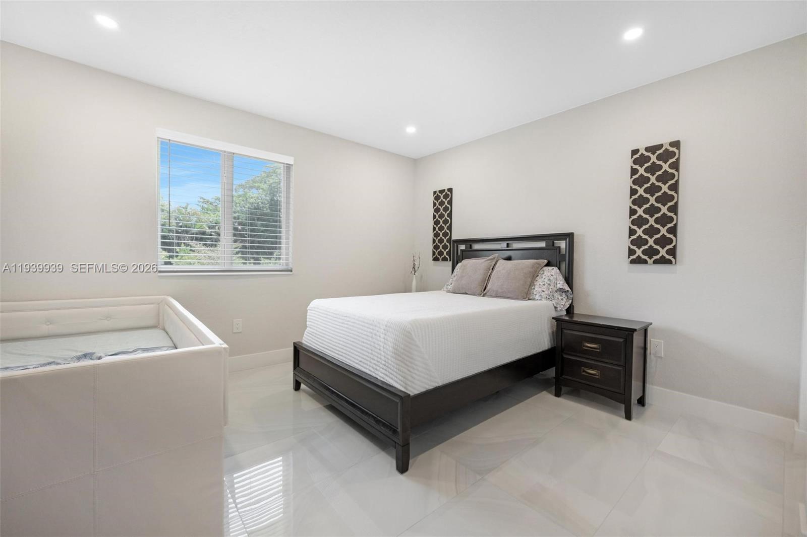 12851 Luray Road Southwest Ranches, FL 33330 - Photo 27 of 43 a bedroom with a bed and a window