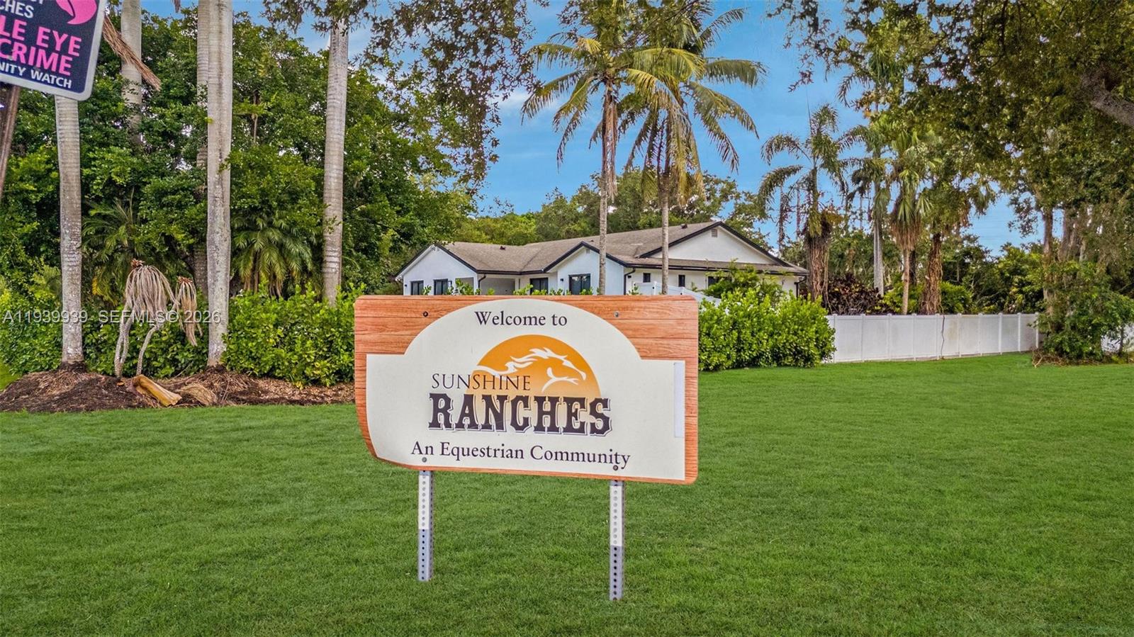 12851 Luray Road Southwest Ranches, FL 33330 - Photo 42 of 43 a sign that is sitting on the grass of the house