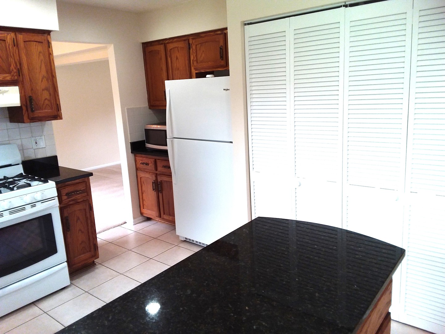7308 Devereux Road Downers Grove, IL 60516 - Photo 19 of 34 a kitchen with a refrigerator and a stove