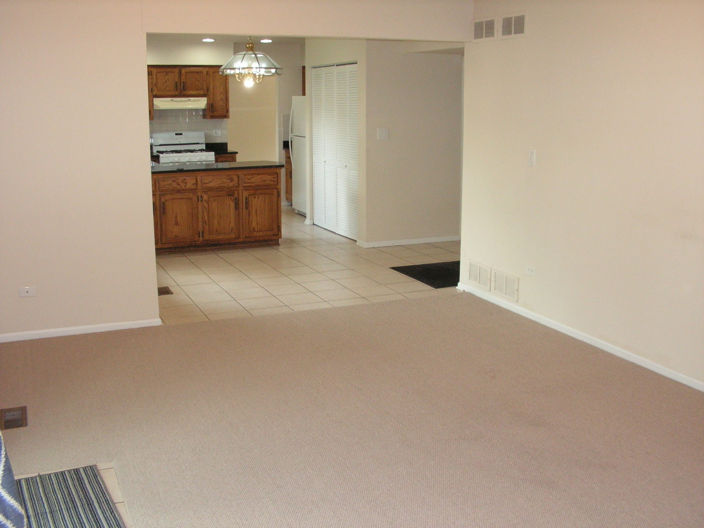 7308 Devereux Road Downers Grove, IL 60516 - Photo 26 of 34 a view of kitchen with refrigerator sink and stove