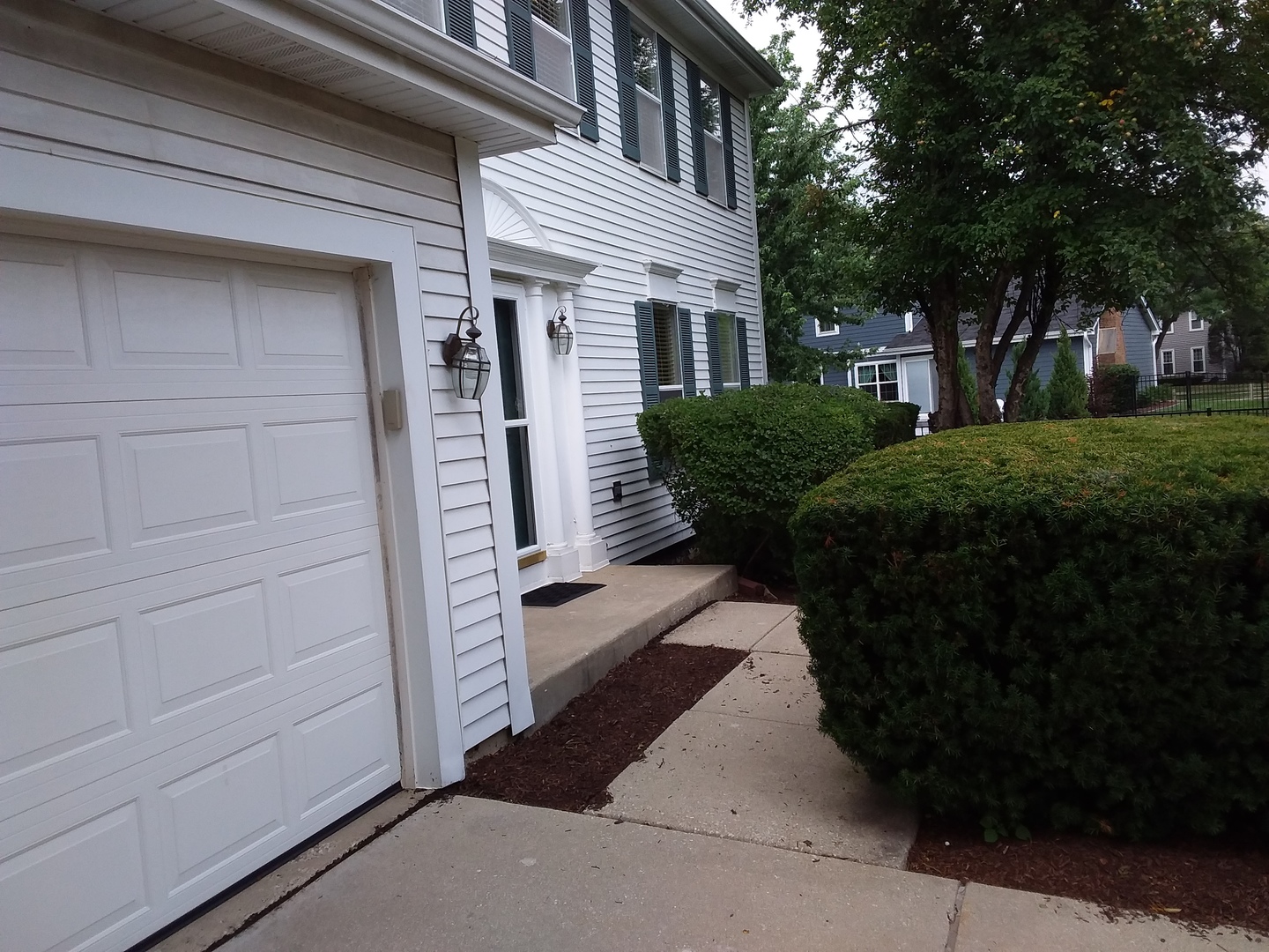7308 Devereux Road Downers Grove, IL 60516 - Photo 3 of 34 a front view of a house with a garden