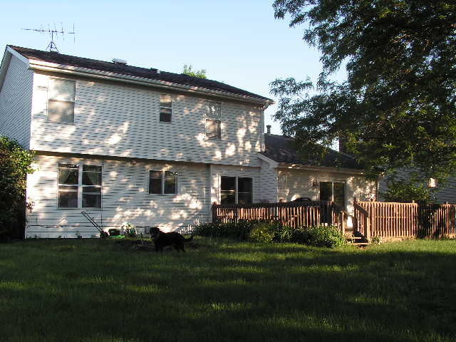 7308 Devereux Road Downers Grove, IL 60516 - Photo 8 of 34 a front view of a house with a garden and porch