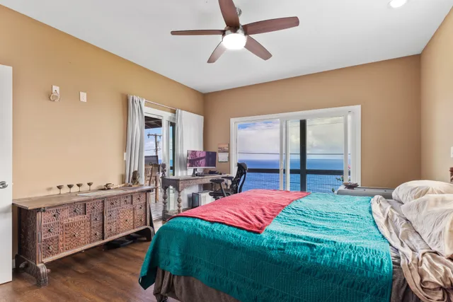 a bedroom with a bed dresser and a window