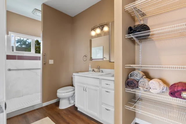 a view of a bathroom with a sink and a mirror