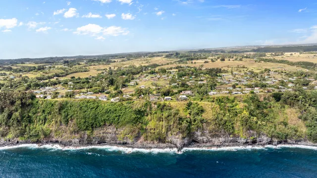 an aerial view of residential building and lake