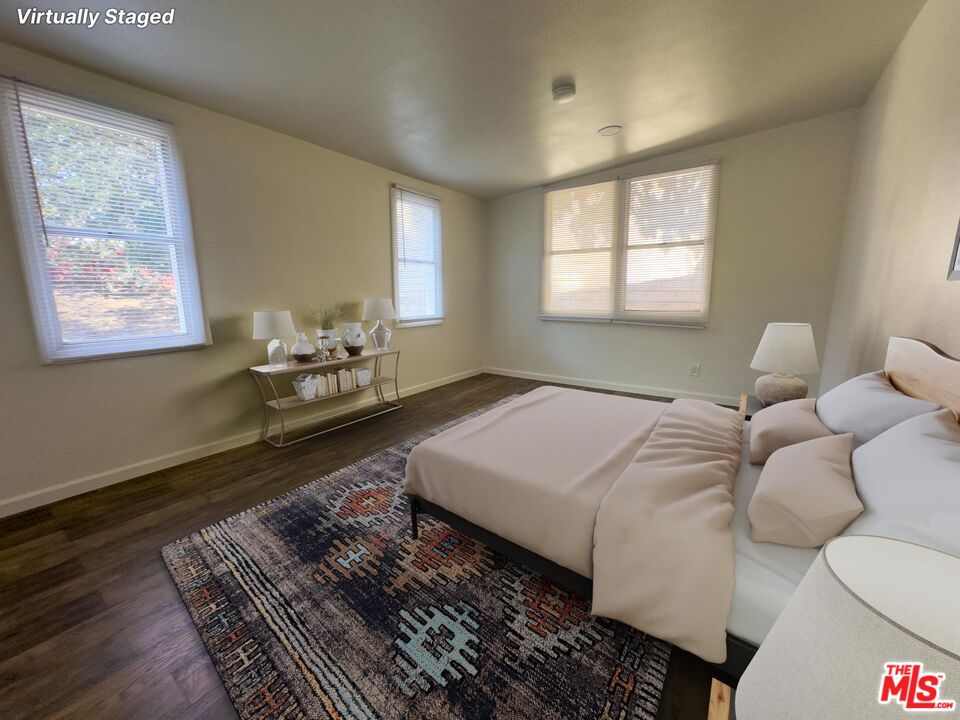 2947 Los Robles Road Thousand Oaks, CA 91362 - Photo 12 of 31 a bedroom with a bed and wooden floor