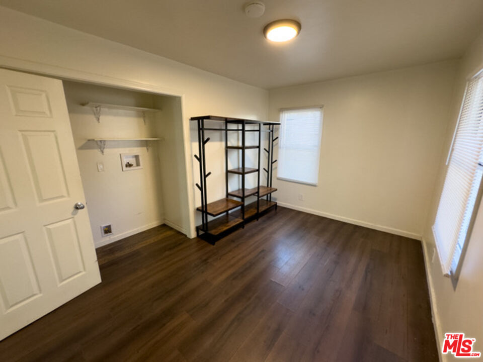 2947 Los Robles Road Thousand Oaks, CA 91362 - Photo 21 of 31 an empty room with wooden floor and windows