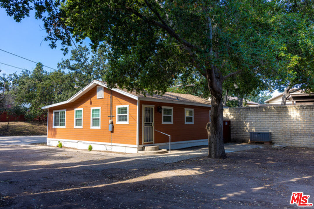 2947 Los Robles Road Thousand Oaks, CA 91362 - Photo 5 of 31 a front view of a house with a yard and garage