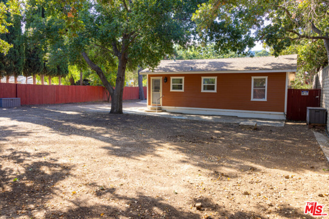 2947 Los Robles Road Thousand Oaks, CA 91362 - Photo 7 of 31 a front view of a house with a yard and garage