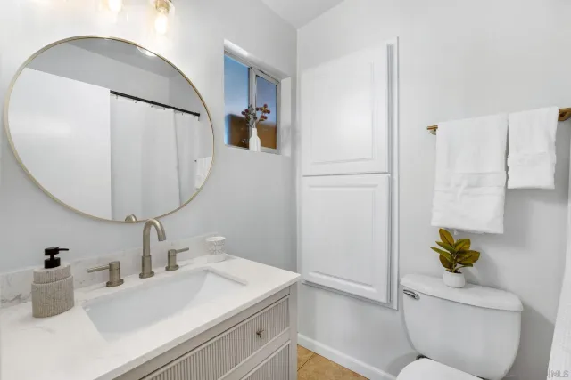 a view of an empty room with potted plant
