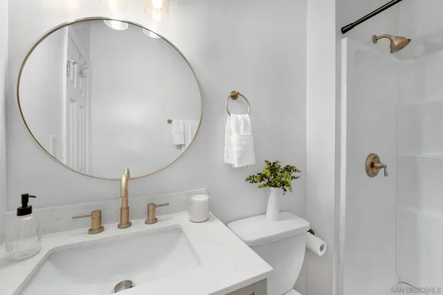 a view of a workspace with furniture and a potted plant