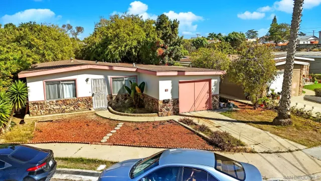 a view of house with backyard porch and sitting area