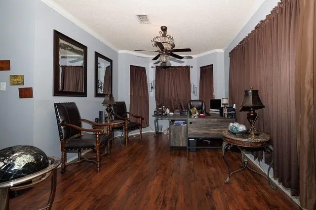 a room with lots of white furniture and window