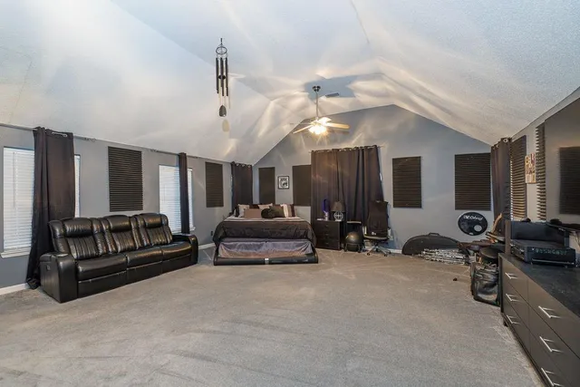 a view of a living room with furniture and a flat screen tv