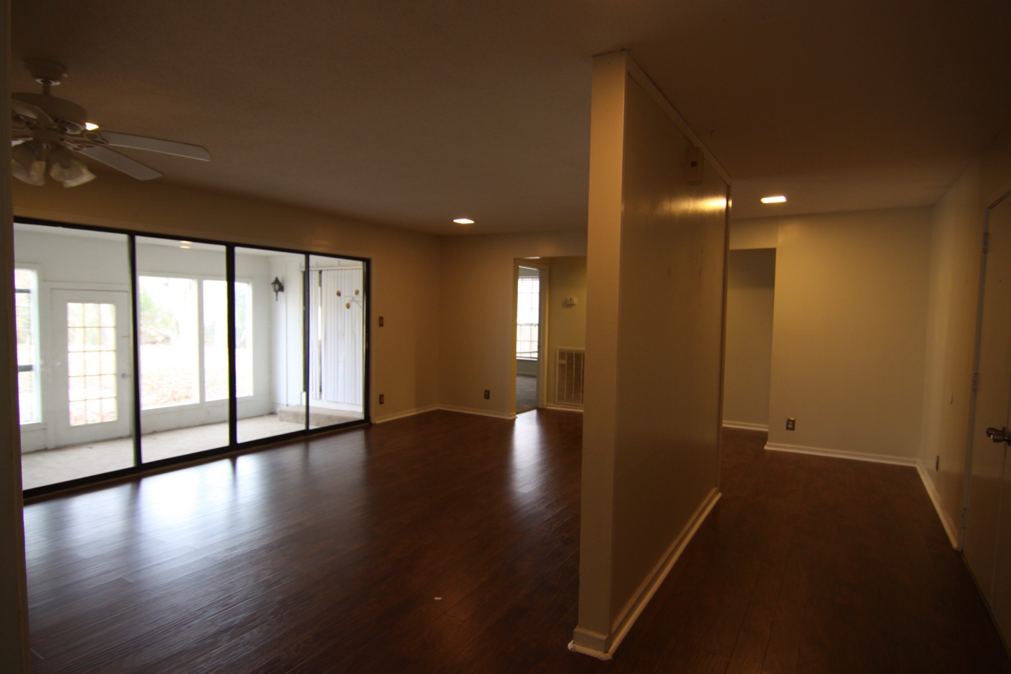 337 Rossview Road Clarksville, TN 37043 - Photo 12 of 22 a view of an empty room with wooden floor and a window