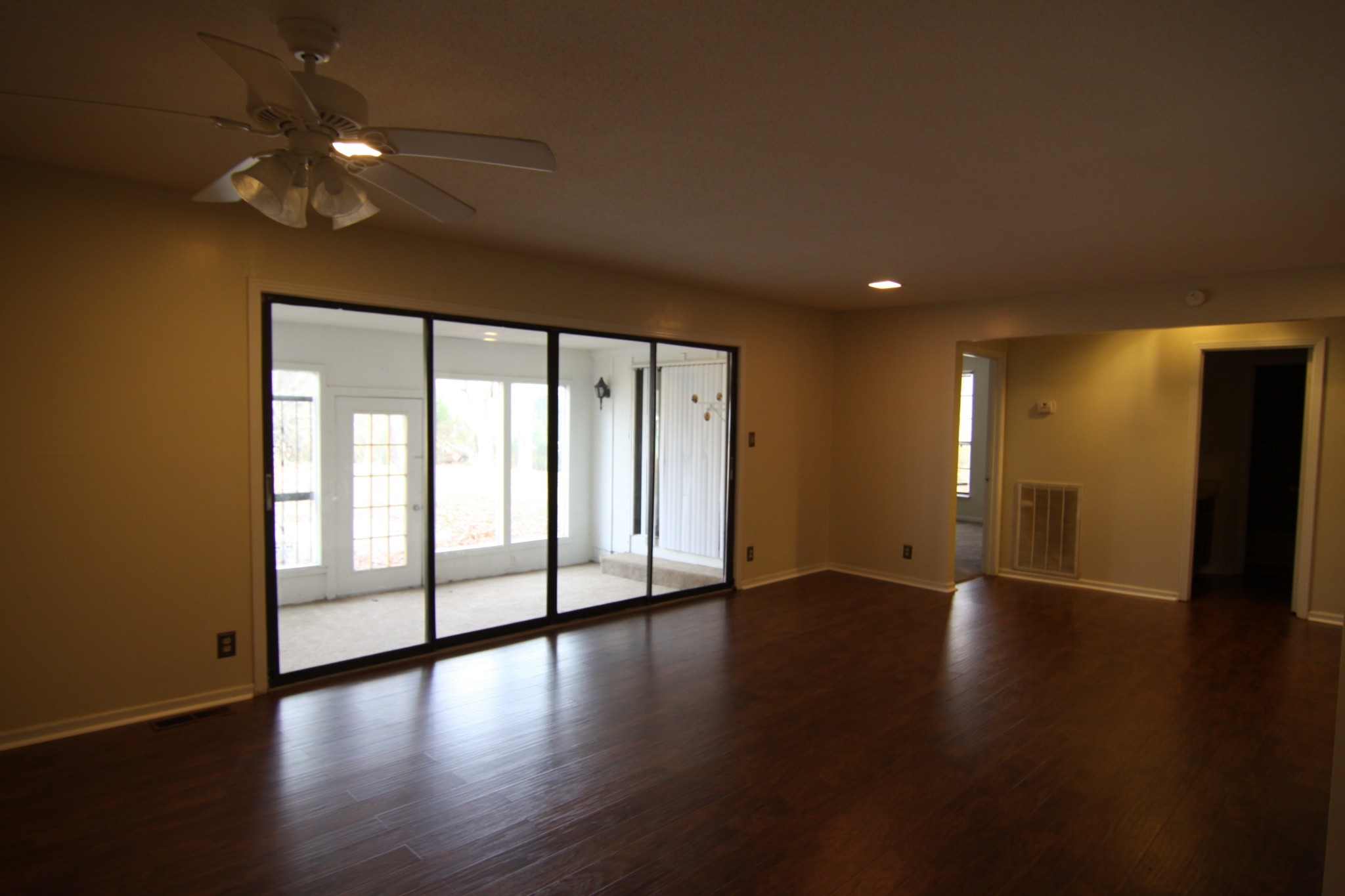 337 Rossview Road Clarksville, TN 37043 - Photo 13 of 22 a view of an empty room with wooden floor and a window