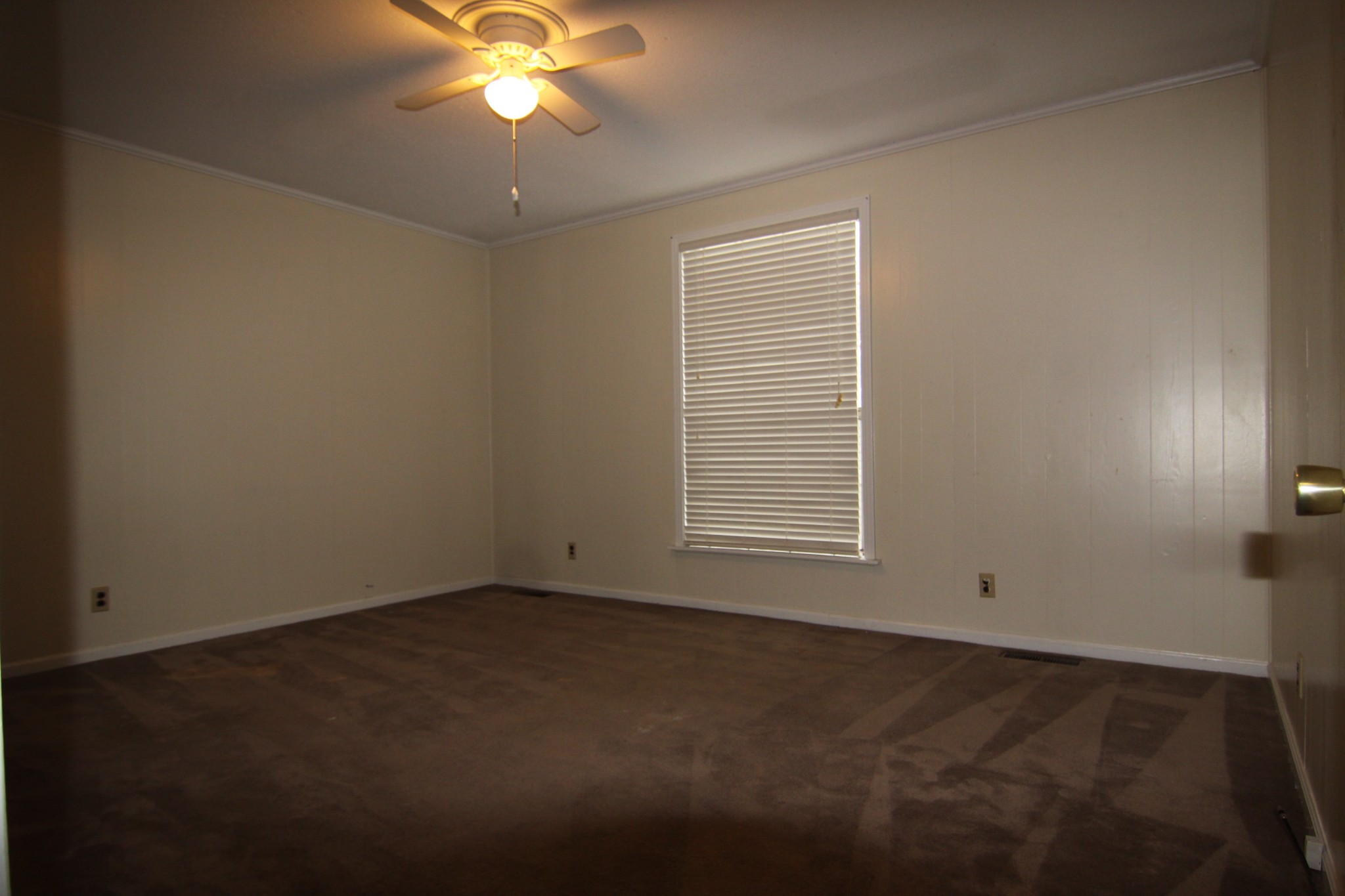 337 Rossview Road Clarksville, TN 37043 - Photo 16 of 22 an empty room with a window and a fan