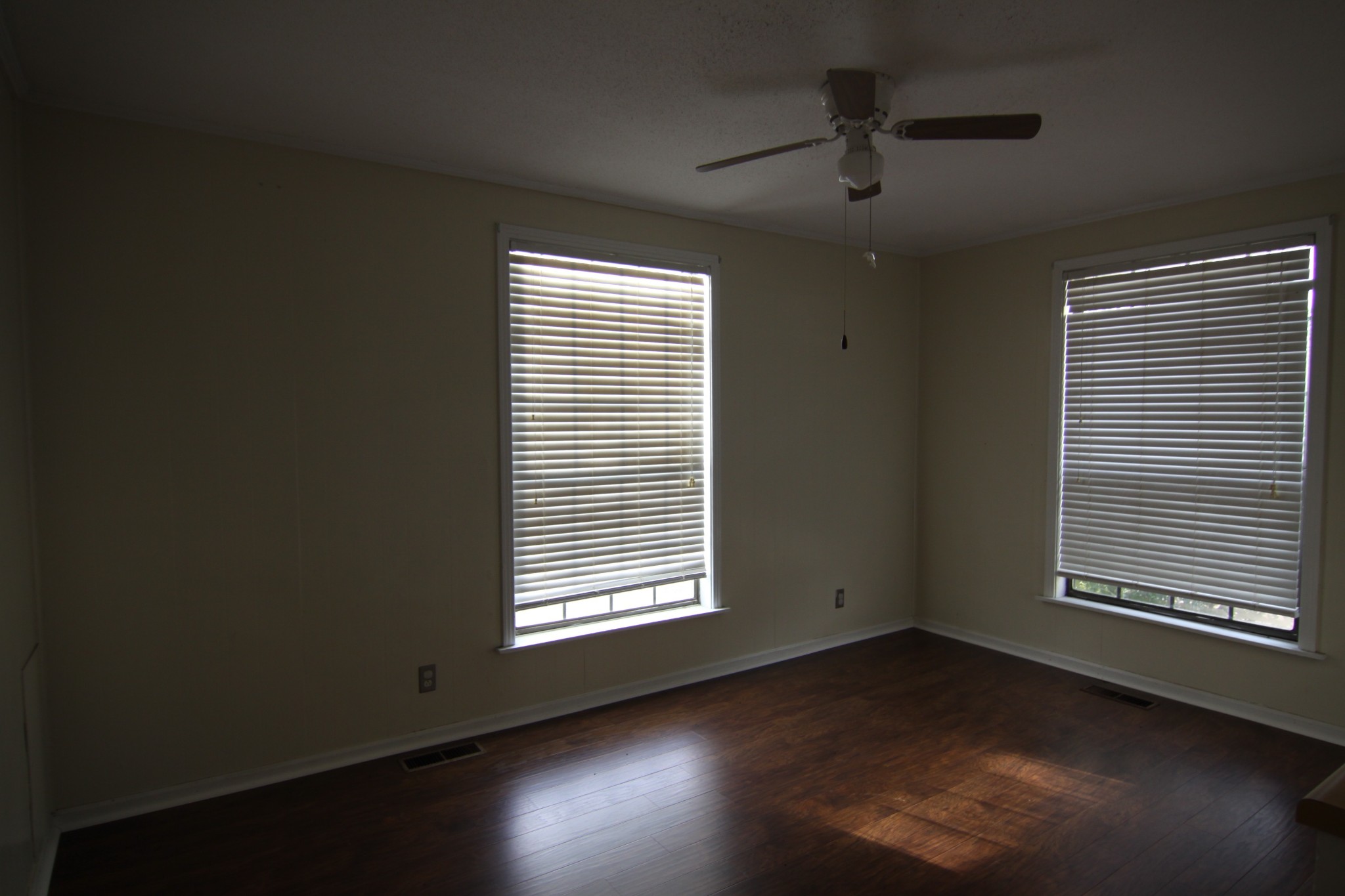 337 Rossview Road Clarksville, TN 37043 - Photo 9 of 22 a view of an empty room with wooden floor and a window