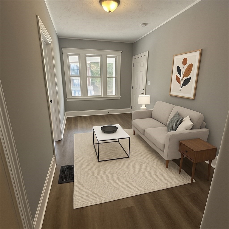 18 Chase Street, Unit 1 Boston, MA 02125 - Photo 7 of 10 a living room with furniture and a window