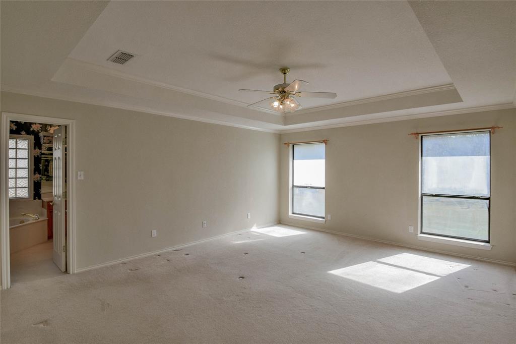 9110 Ravenswood Road Granbury, TX 76049 - Photo 19 of 40 Primary Bedroom with ensuite bath