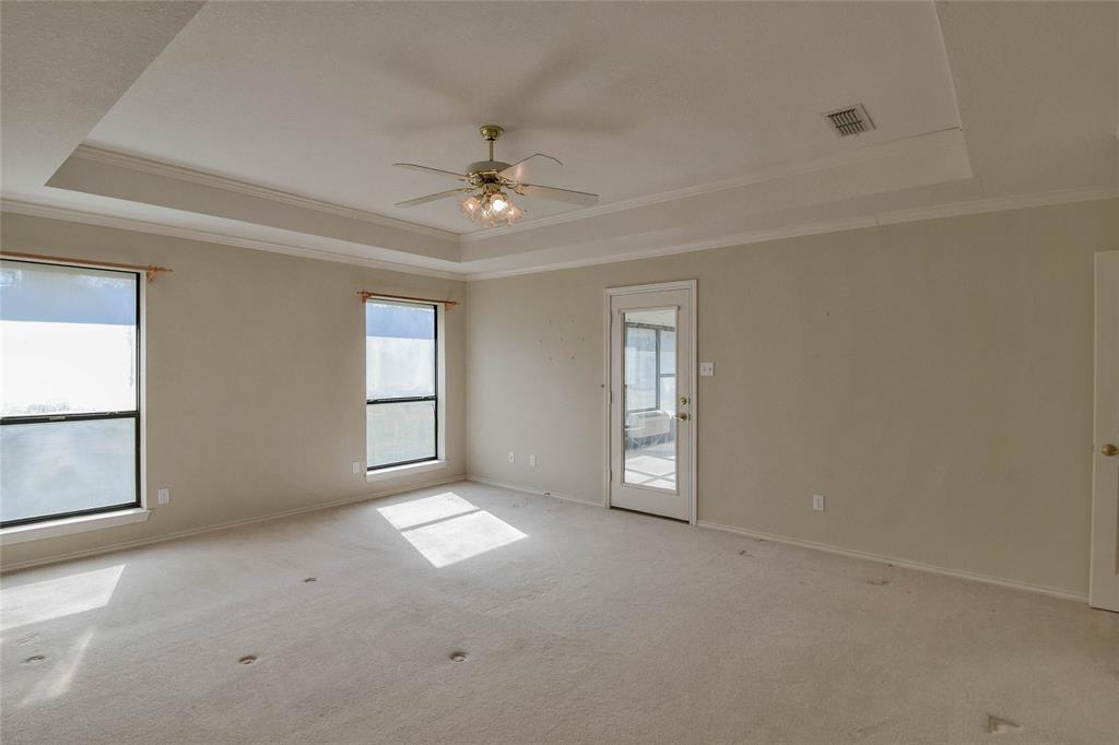 9110 Ravenswood Road Granbury, TX 76049 - Photo 21 of 40 Primary Bedroom with access to the enclosed sunroom