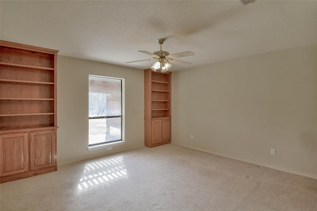 9110 Ravenswood Road Granbury, TX 76049 - Photo 28 of 40 Bedroom with built-in shelving