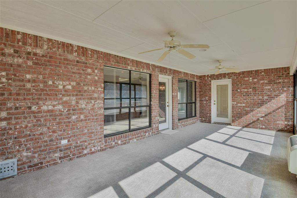 9110 Ravenswood Road Granbury, TX 76049 - Photo 31 of 40 Sunroom with ceiling fan and new carpet