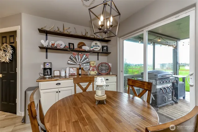 a bathroom with a granite countertop sink a large mirror a and a bathtub