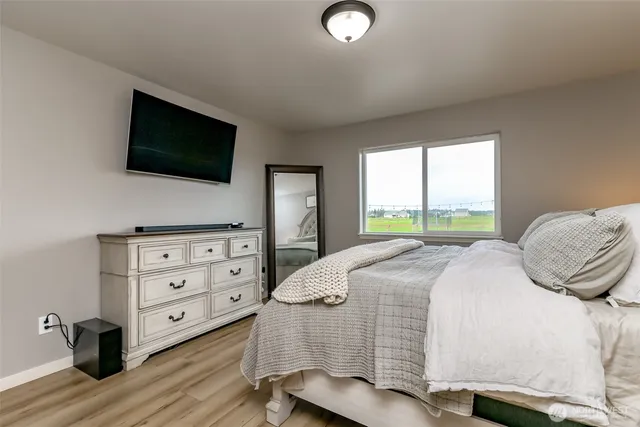 a bedroom with a bed and furniture