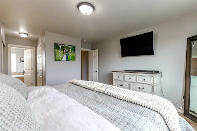 a bedroom with a bed and a window