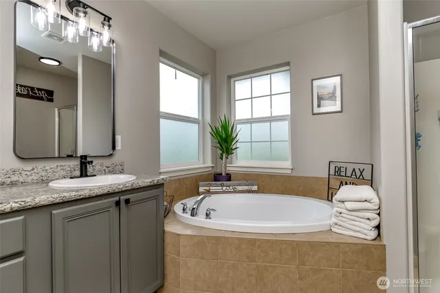 a bathroom with a toilet and a shower curtain