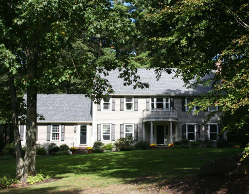 88 Sawmill Road North Andover, MA 01845 - Photo 1 of 1 a front view of a house with a garden