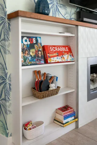 a picture of a book shelf with wooden floor