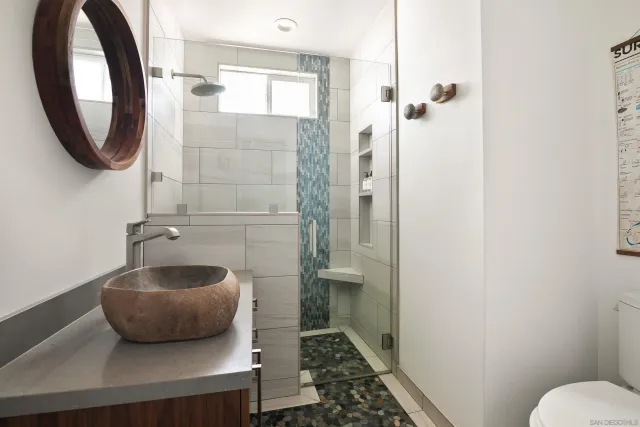 a bathroom with a sink and a mirror