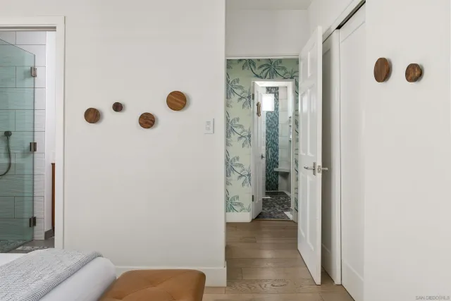 a large bed sitting in a bedroom next to a window