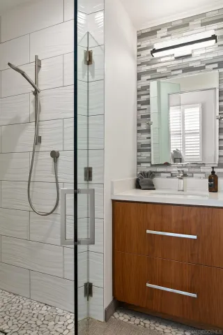 a bedroom with a bed and a white cabinet