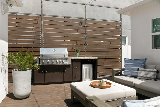 a bathroom with a sink and a potted plant
