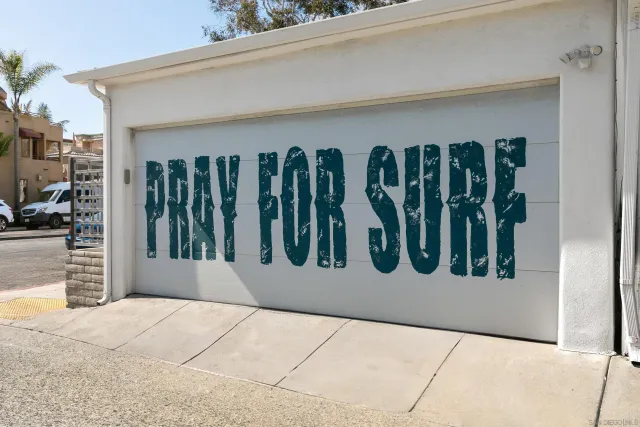 an aerial view of a house with a big yard