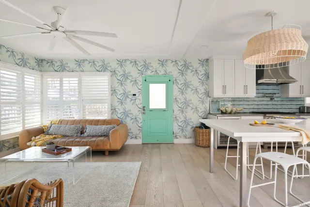 a living room with furniture a table and a chandelier