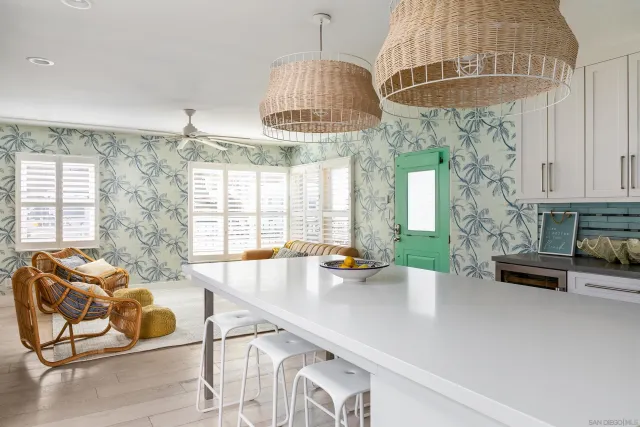 a very nice looking room with a large window and chandelier