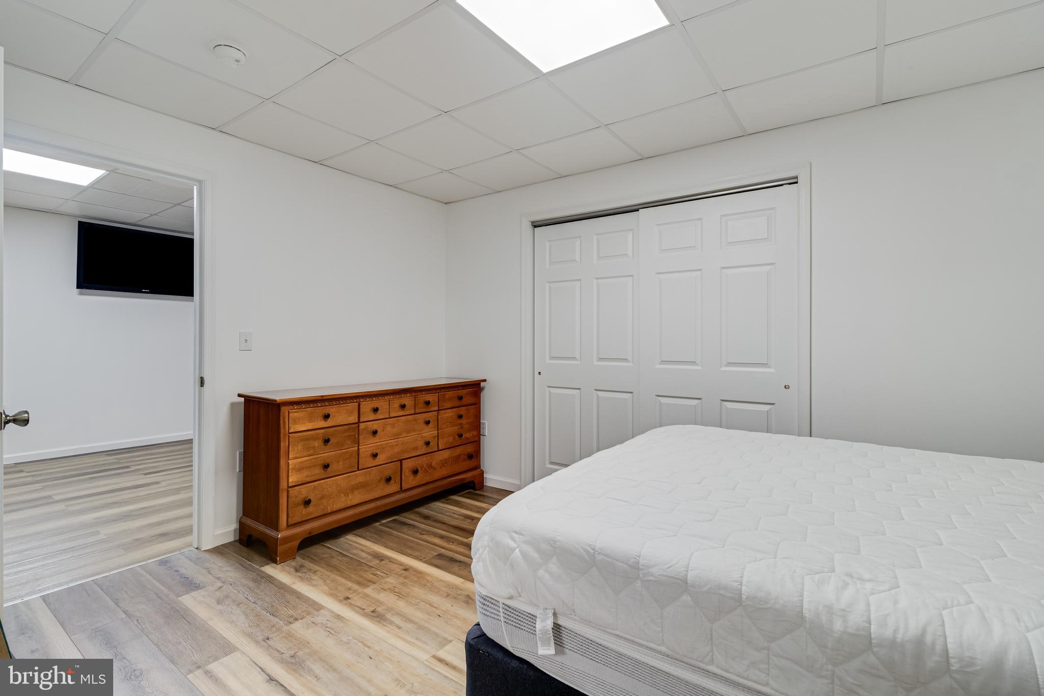 12015 Woodbury Road Nanjemoy, MD 20662 - Photo 40 of 53 a bedroom with a bed and a television